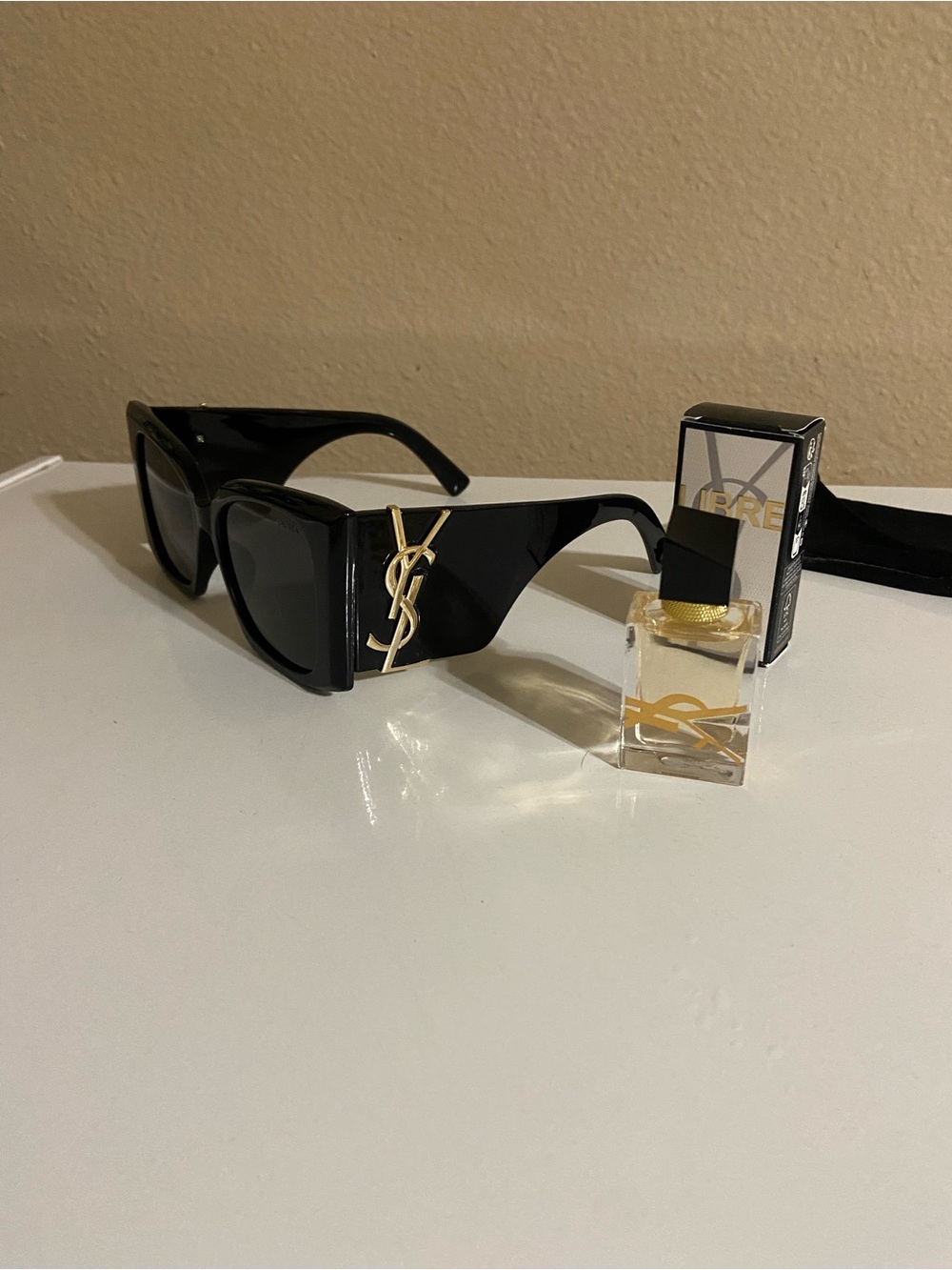 Yves Saint Laurent Black Cat-Eye Sunglasses and travel size YSL libre perfume